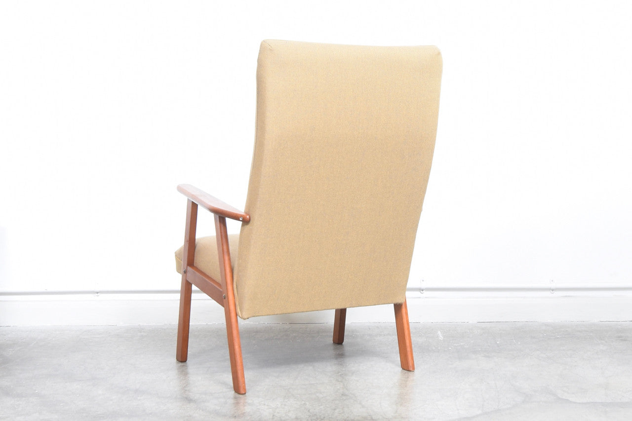 High back lounge chair with a teak frame