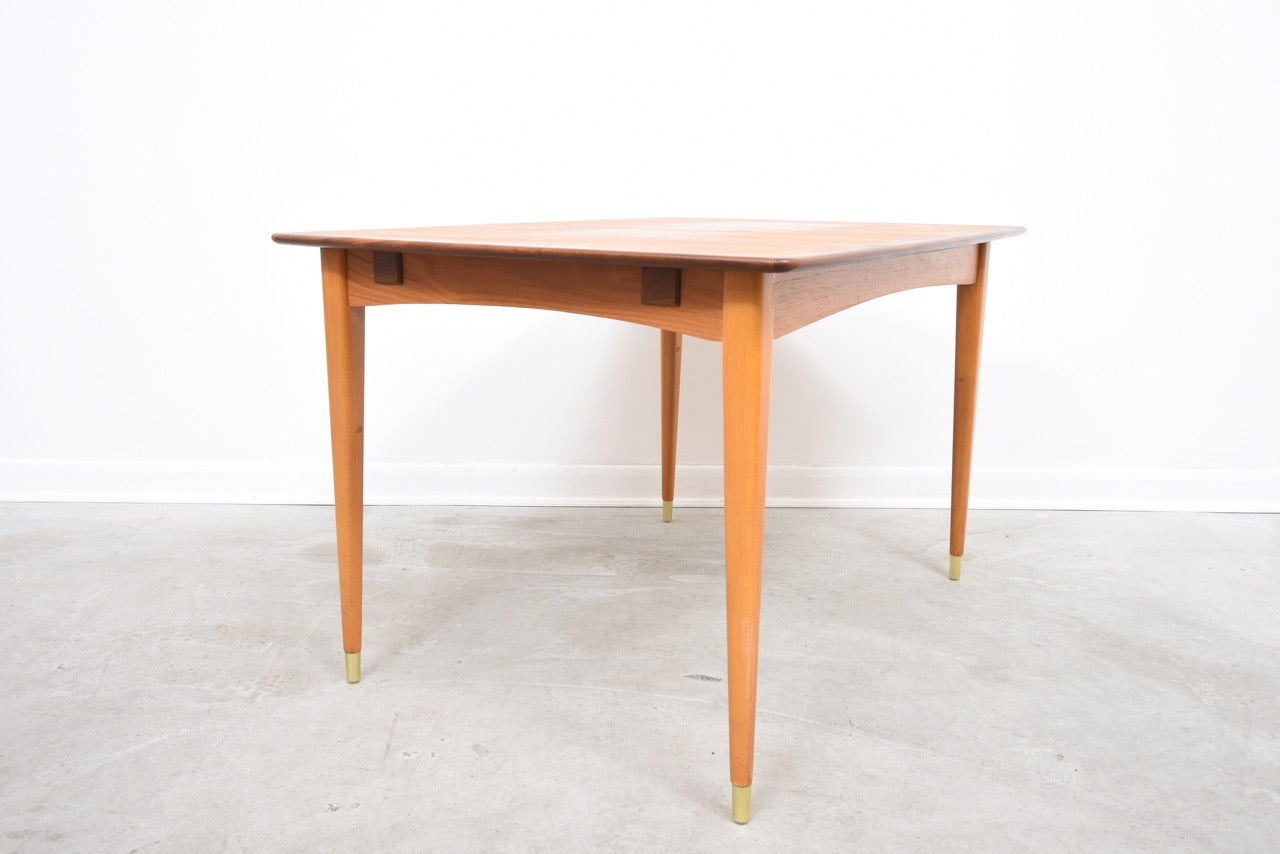 Extending teak dining table on beech legs