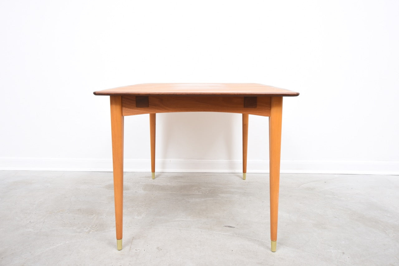 Extending teak dining table on beech legs