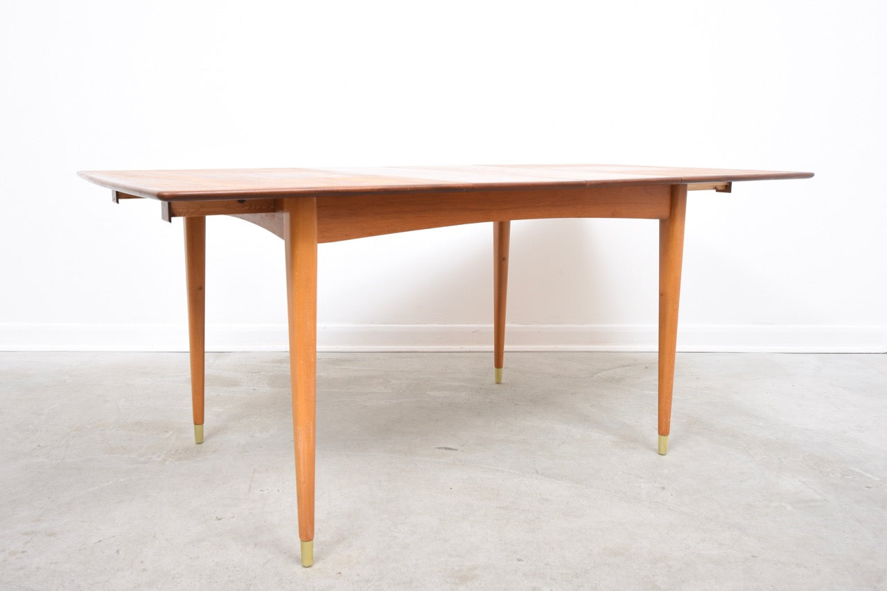 Extending teak dining table on beech legs