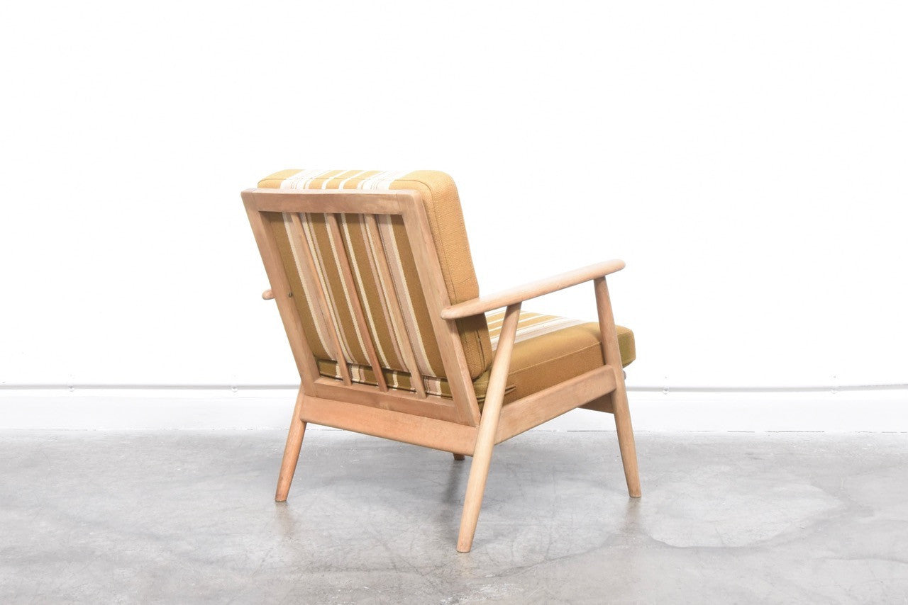 Matching pair of loungers with striped cushions