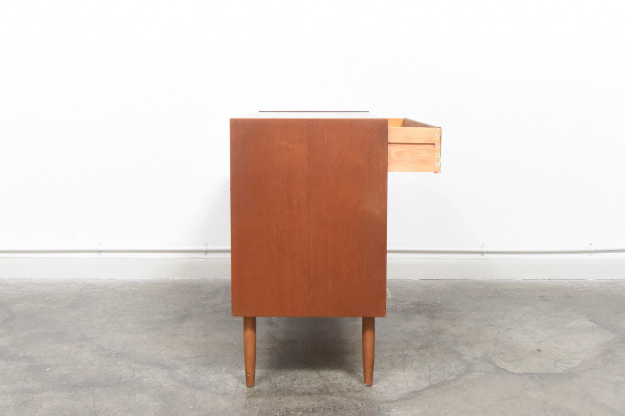 Short chest of four drawers with inset handles