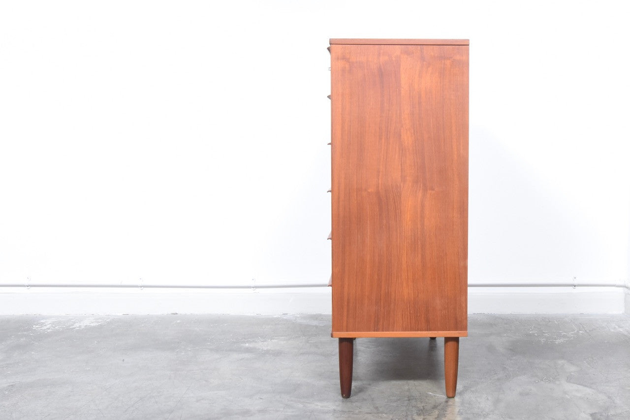 Teak chest of six drawers with lipped handles