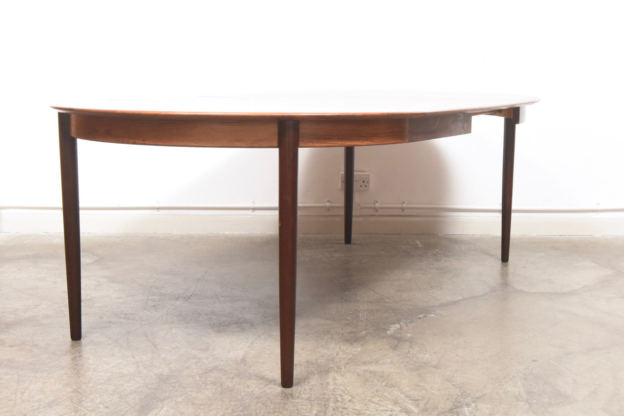 Extending rosewood dining table by Skovby