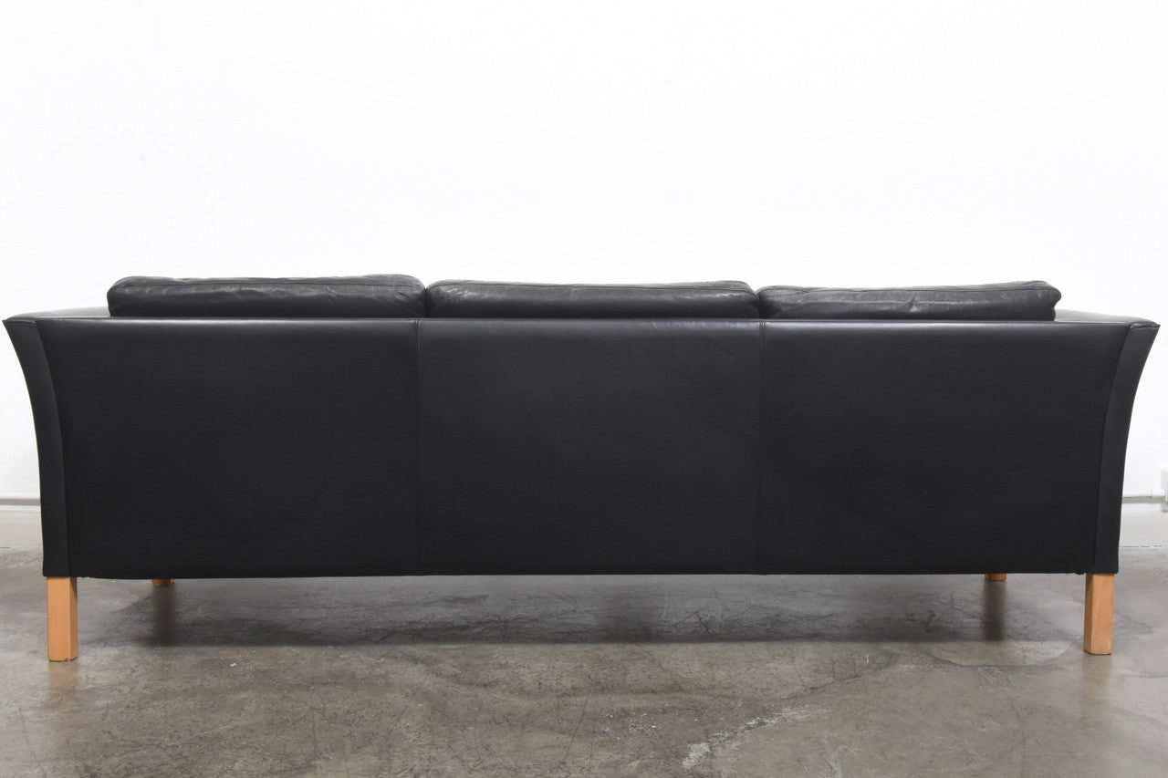 Black leather three seat sofa by Mogens Hansen