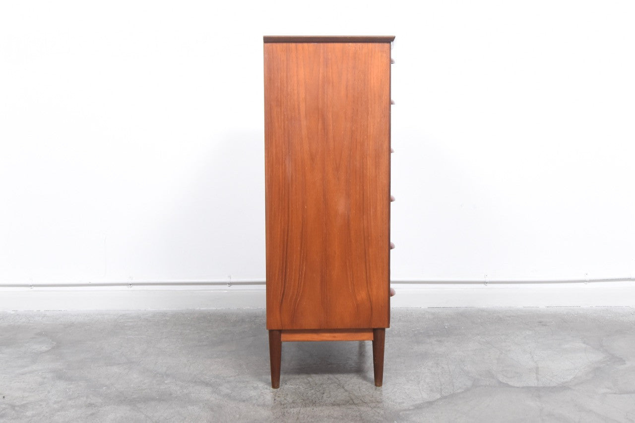 Bow-fronted teak chest of drawers