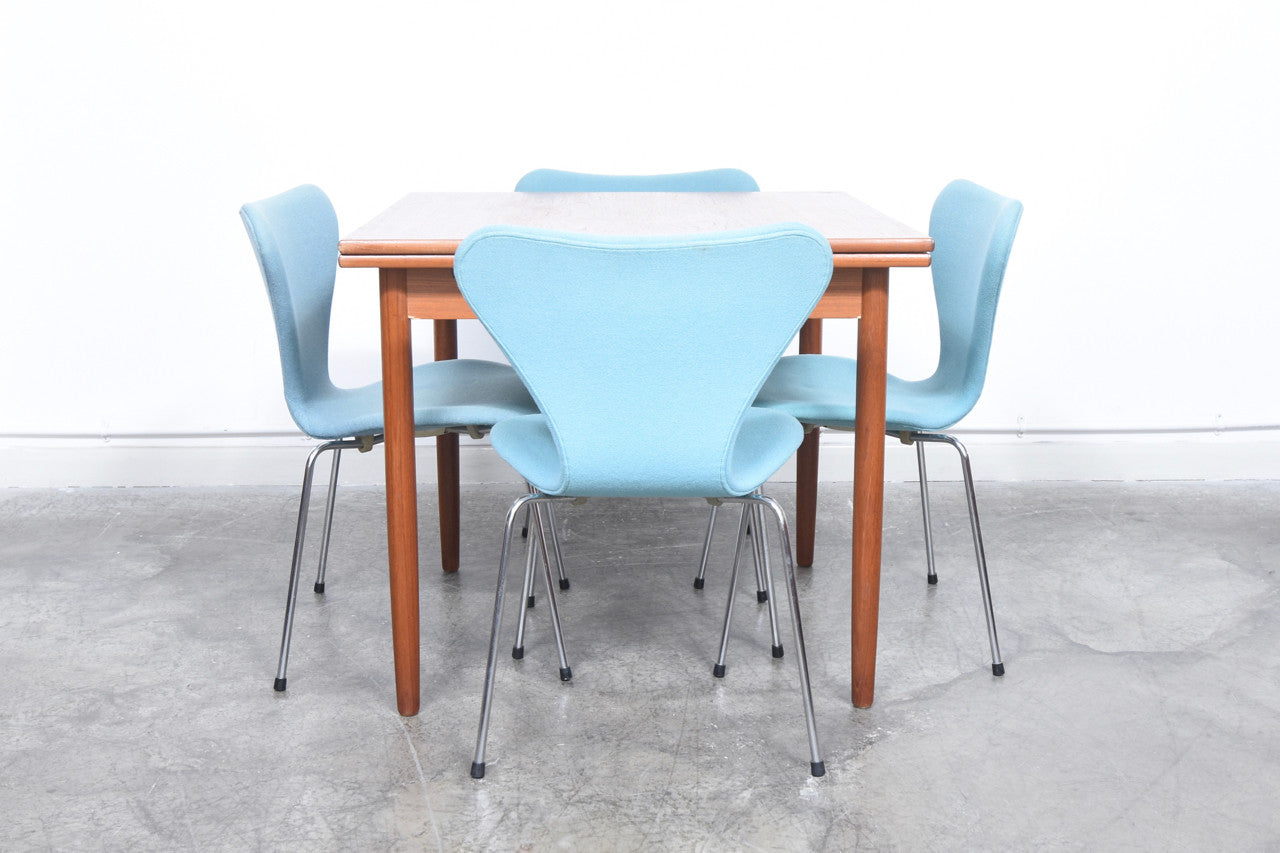 Extending square dining table in teak