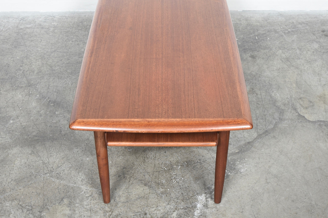 Teak coffee table with magazine shelf