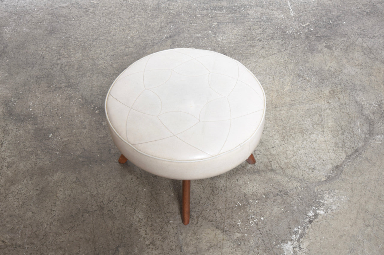 Foot stool on splayed legs