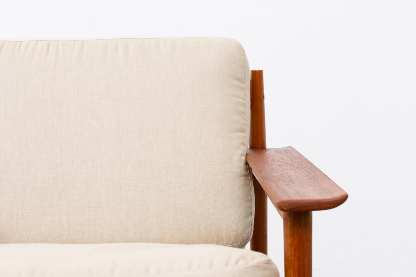 1960s teak lounger with linen cushions