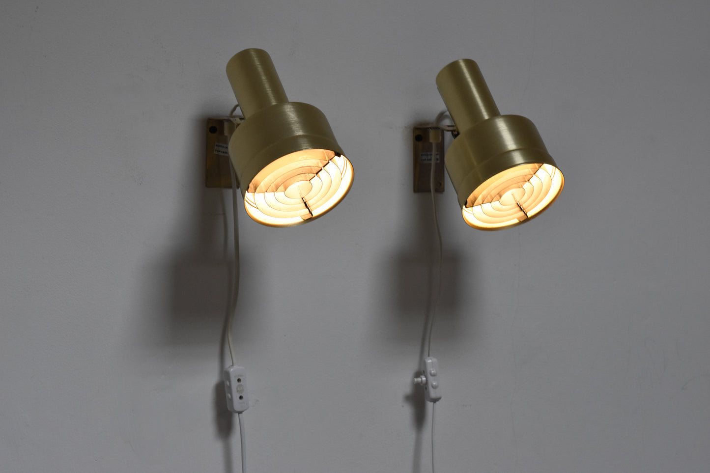 Pair of brass bedside lamps by Kosta Lampan