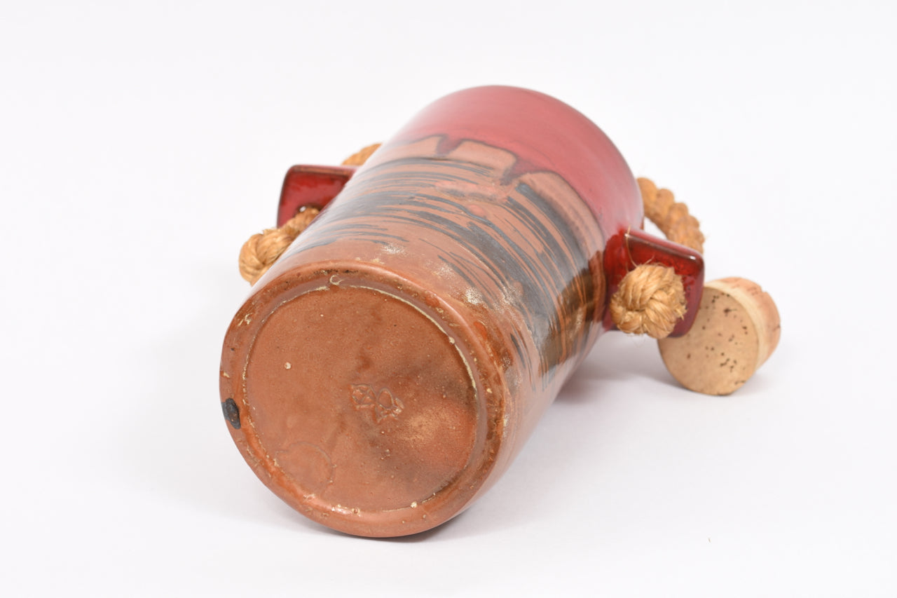 Stoneware jug with cork lid and rope handle