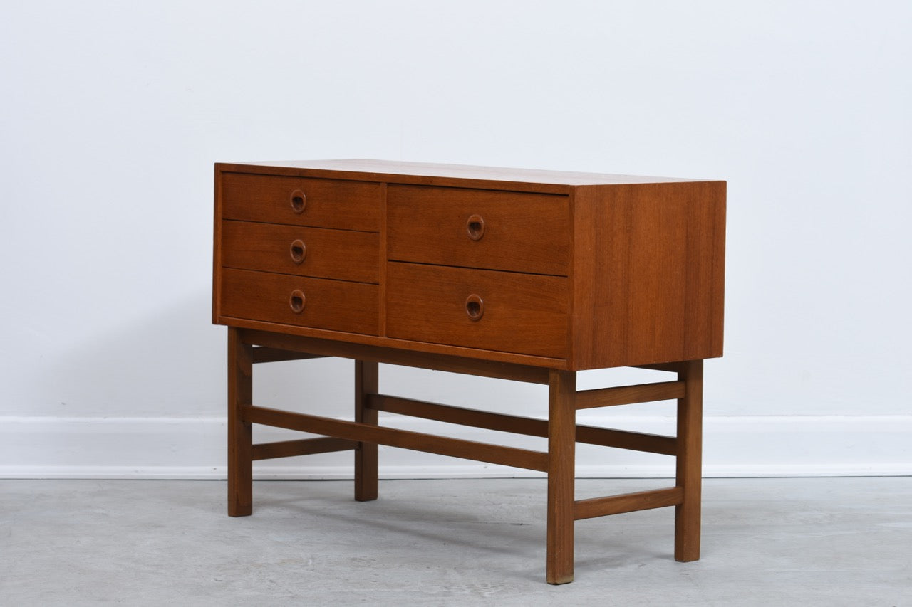 Short chest of five teak drawers