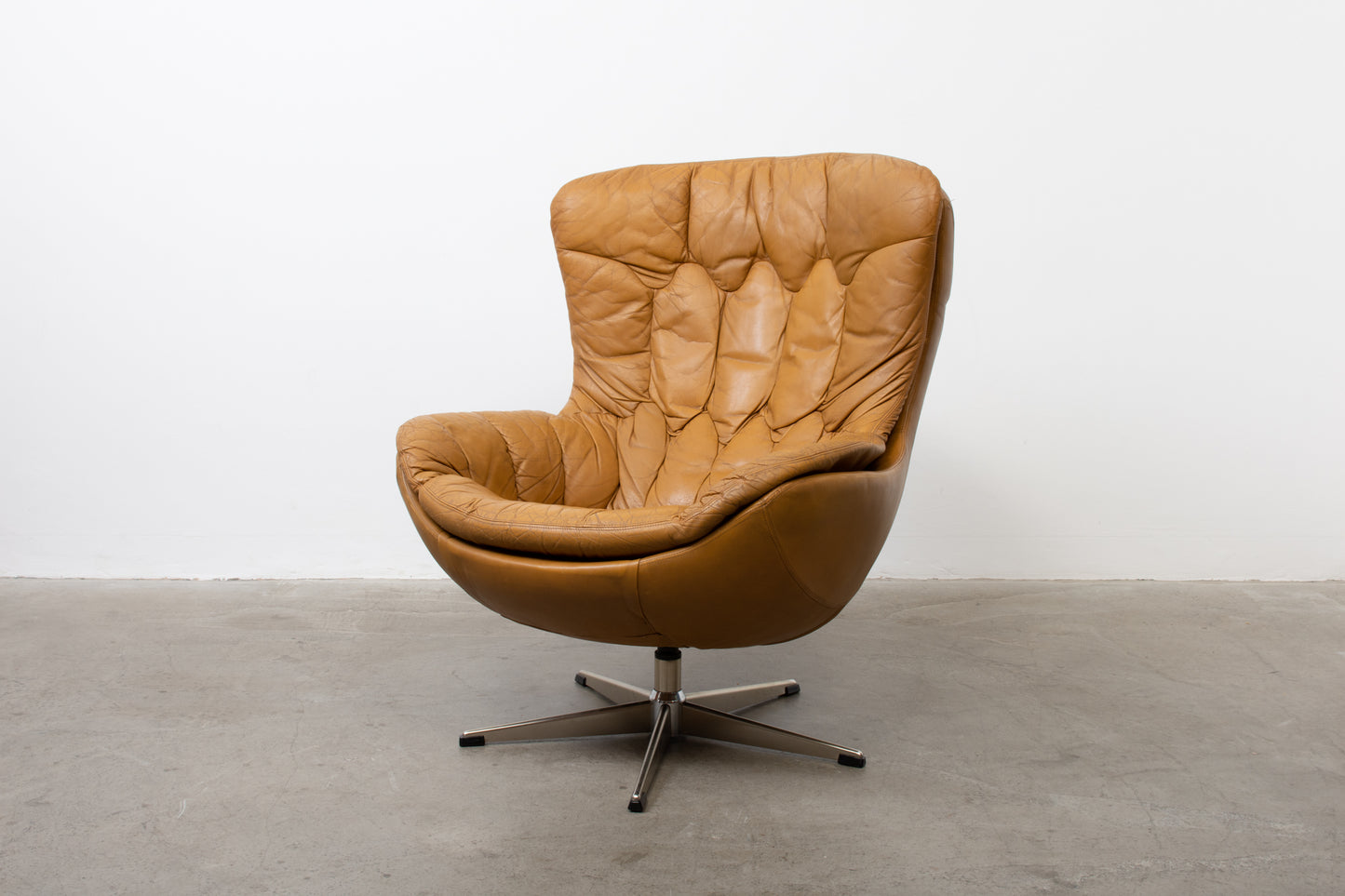 1960s leather swivel chair with foot stool