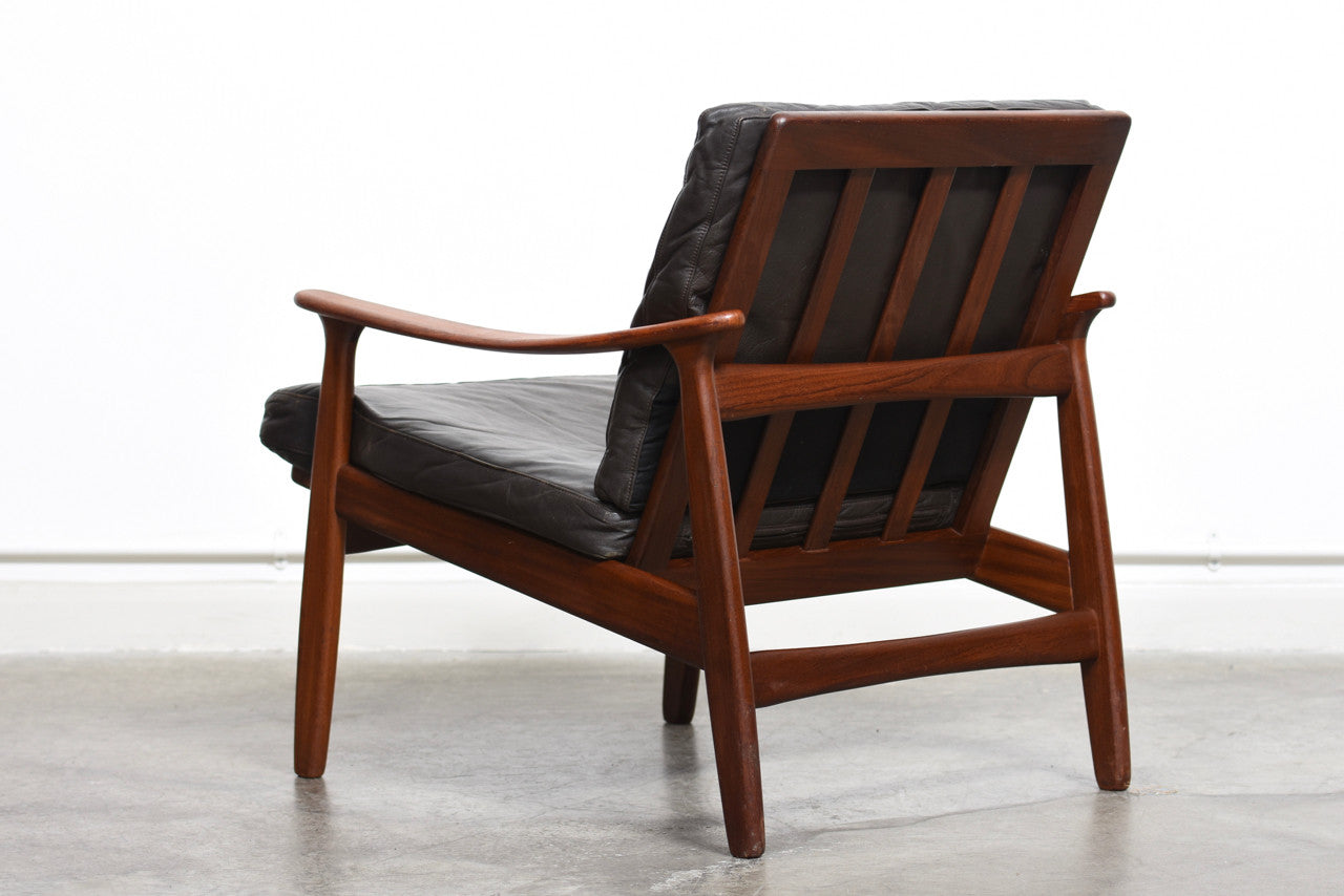 Teak lounge chair with leather cushions