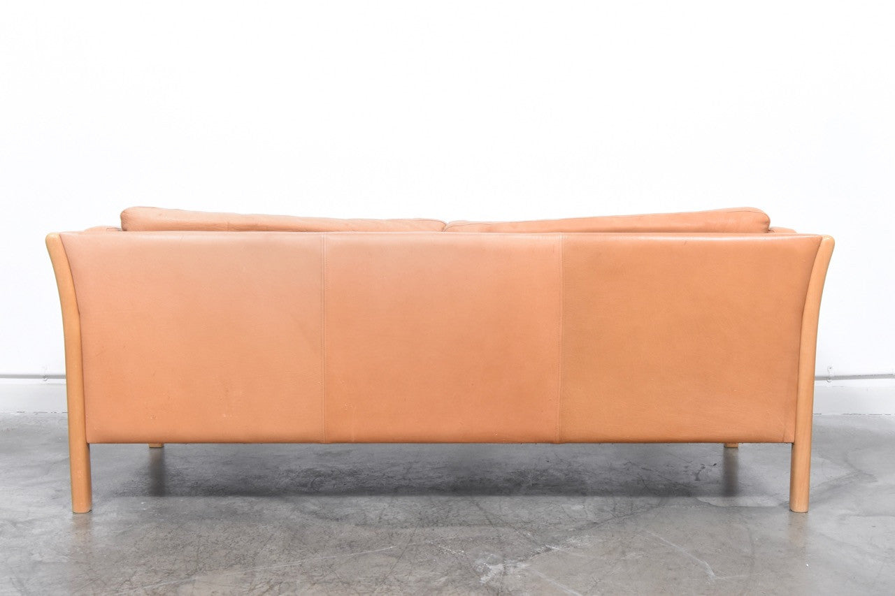 Two and a half seater in tan leather