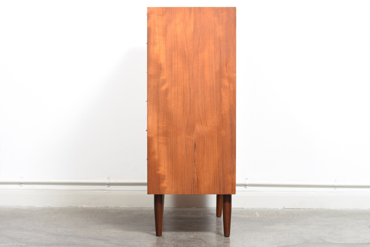 Teak chest of drawers with lipped handles