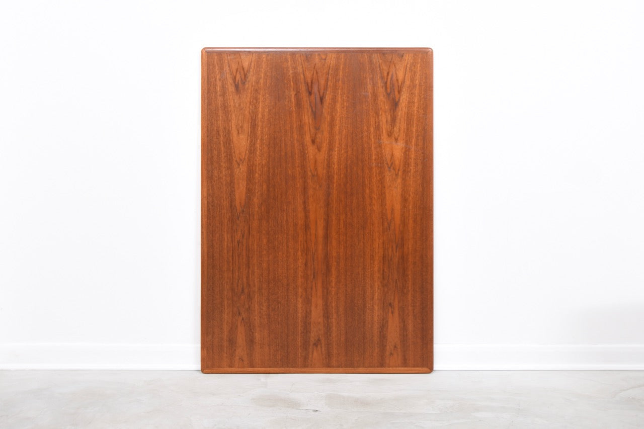 Large extending dining table in teak