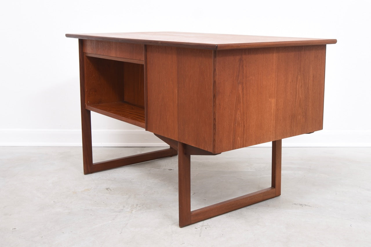 Single pedestal desk in teak