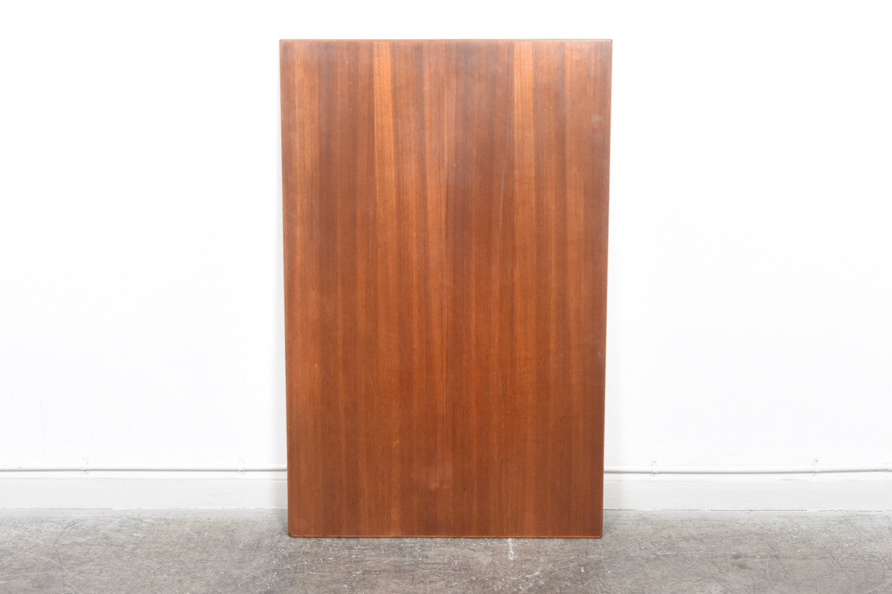 Extending rectangular dining table in teak