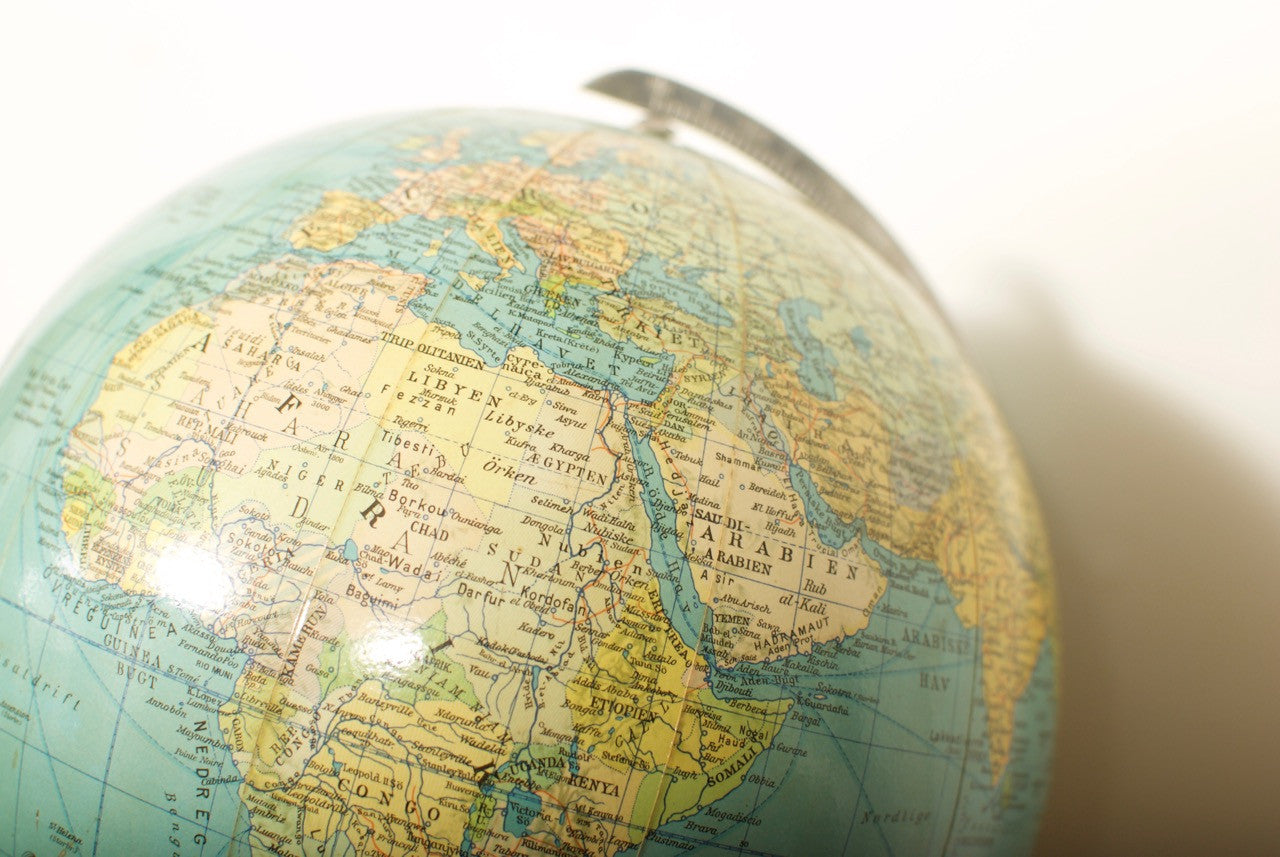 Glass globe by Nordisk Konversations Leksikon