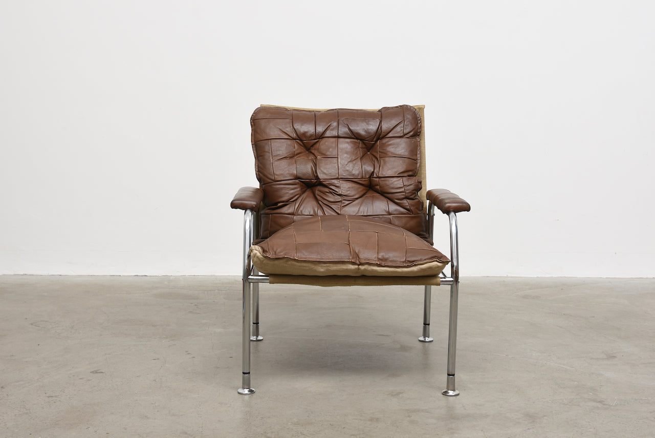 Two available: 1970s leather + metal lounge chairs