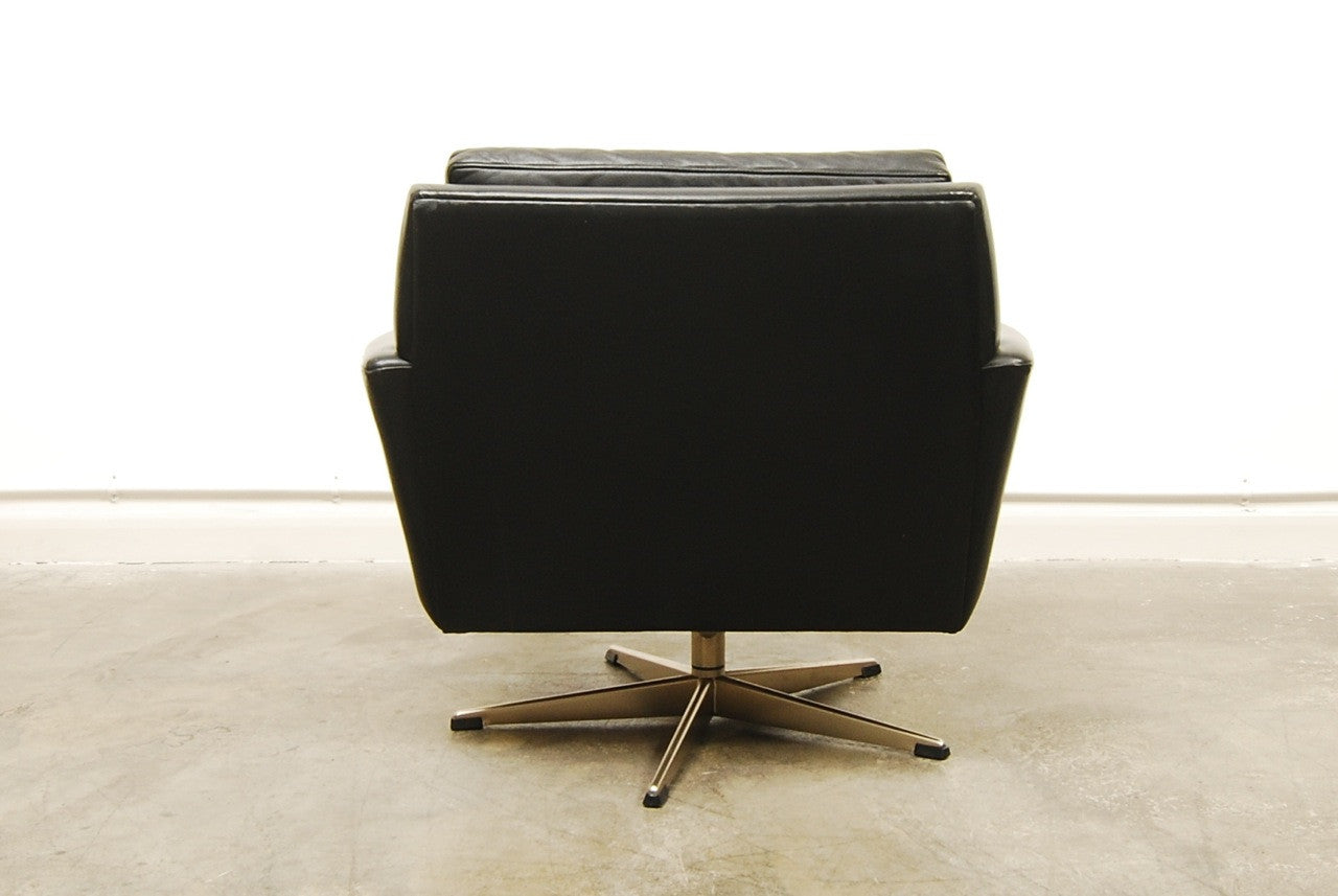Low back leather lounger on swivel base