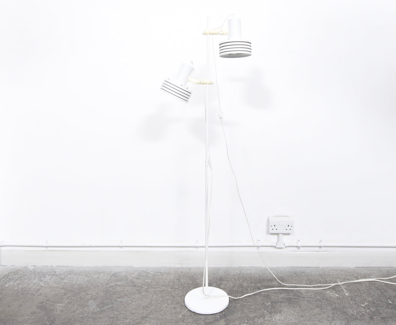 Twin-headed floor lamp with multi-tiered white shades