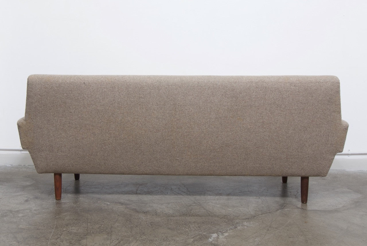 Three seat fabric sofa with striped cushions