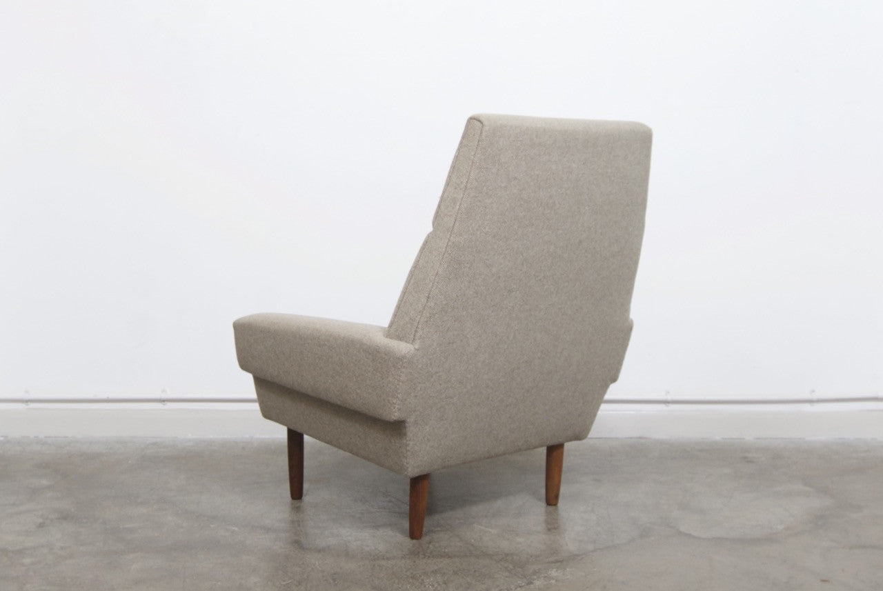 High back lounger with striped cushions