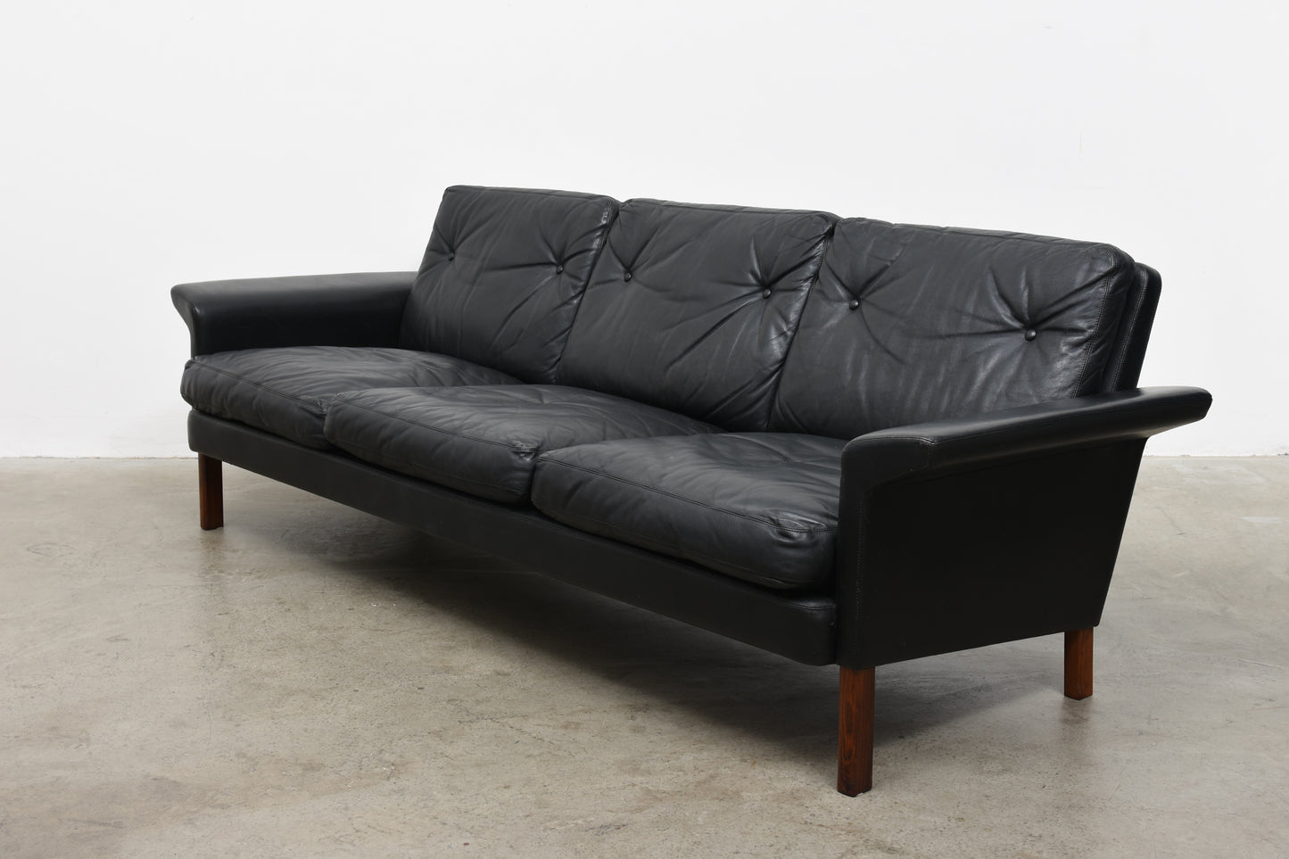 Three seat leather sofa by Hans Olsen