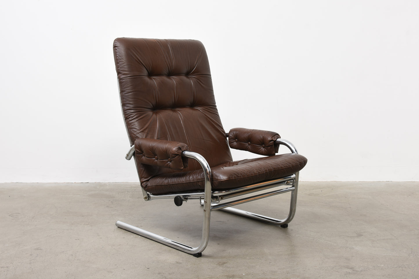 Two available: 1970s leather + metal loungers