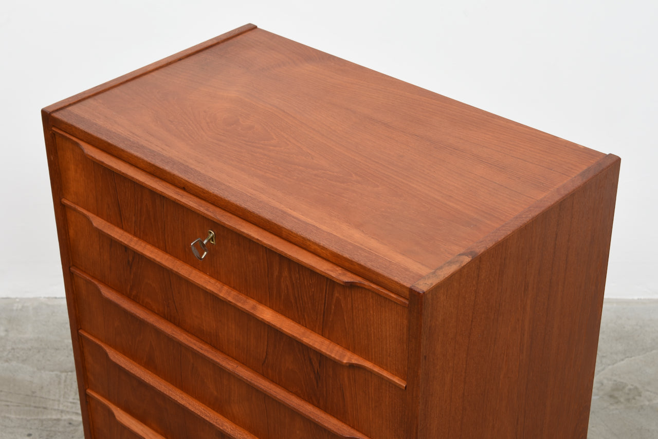 Teak chest of drawers with lipped handles