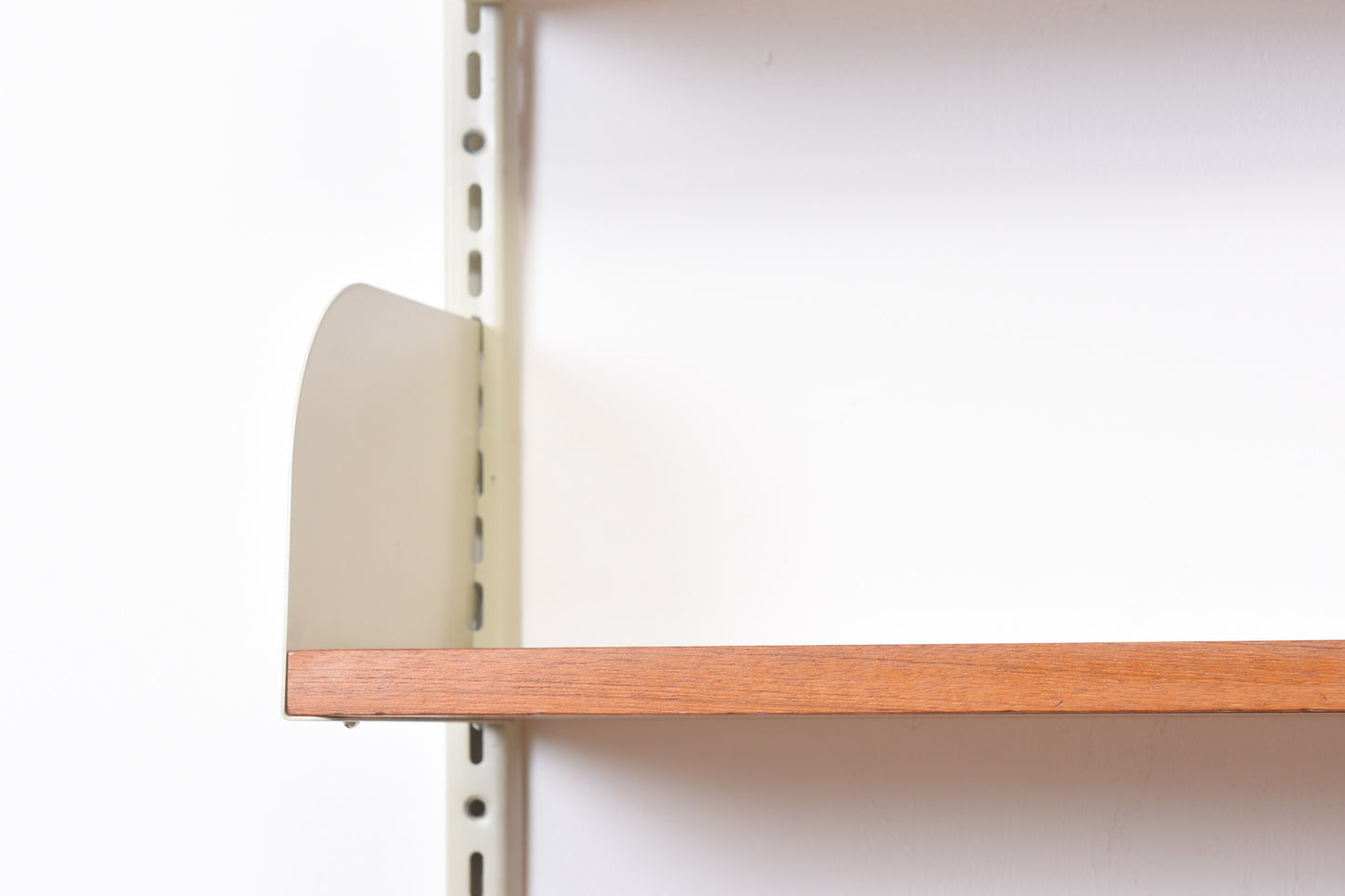 Single bay of teak shelving