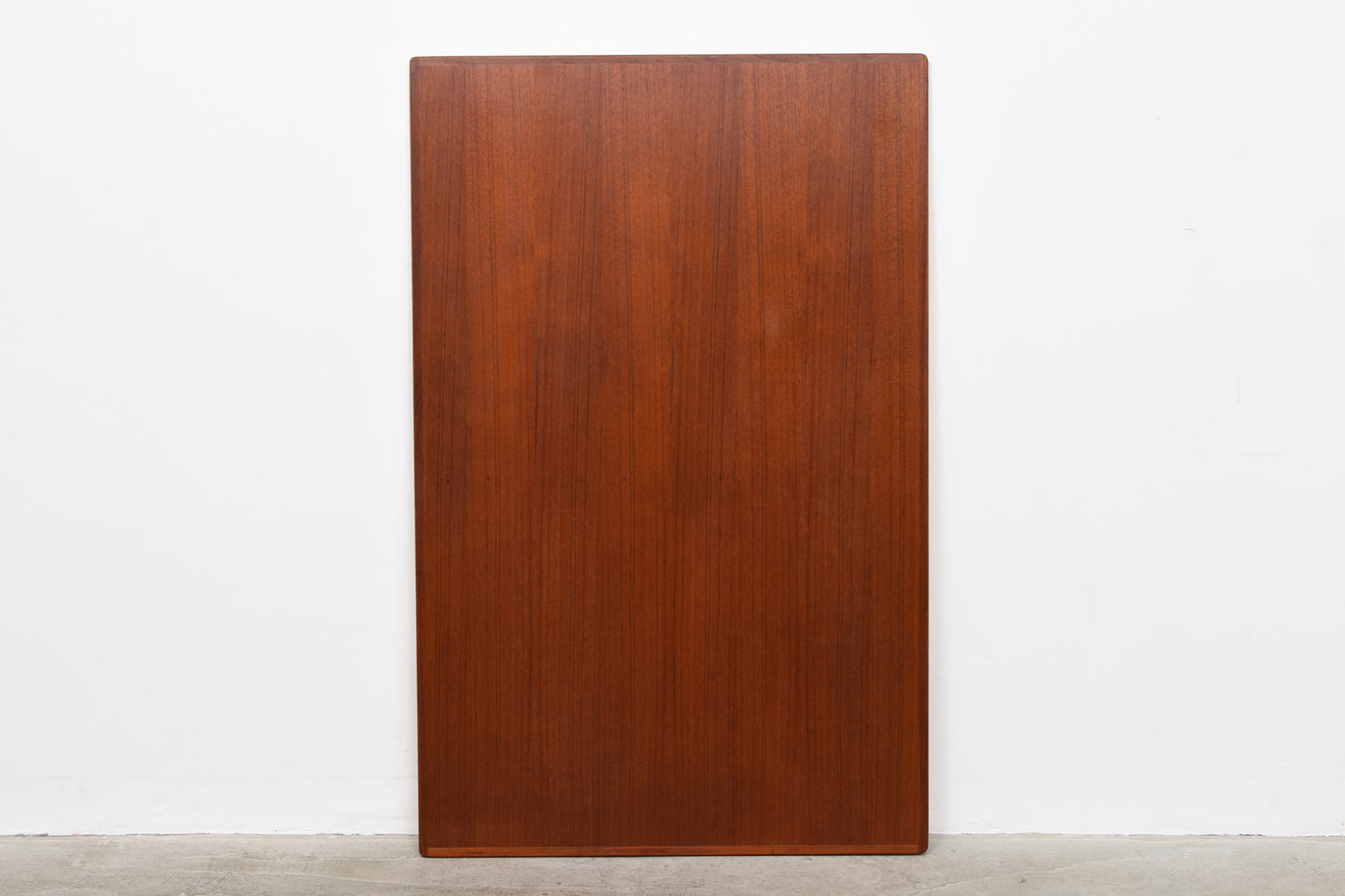 Extending teak dining table