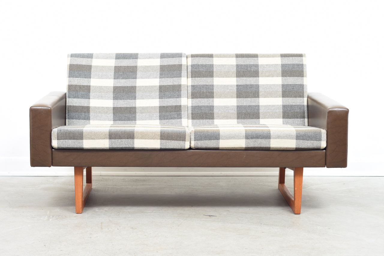Two seat sofa on teak sleigh legs