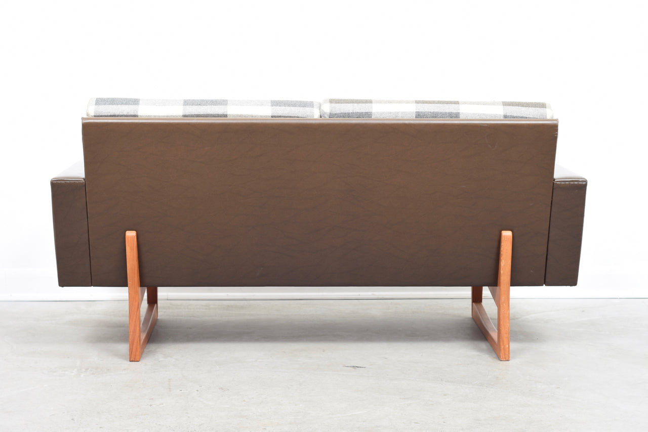 Two seat sofa on teak sleigh legs