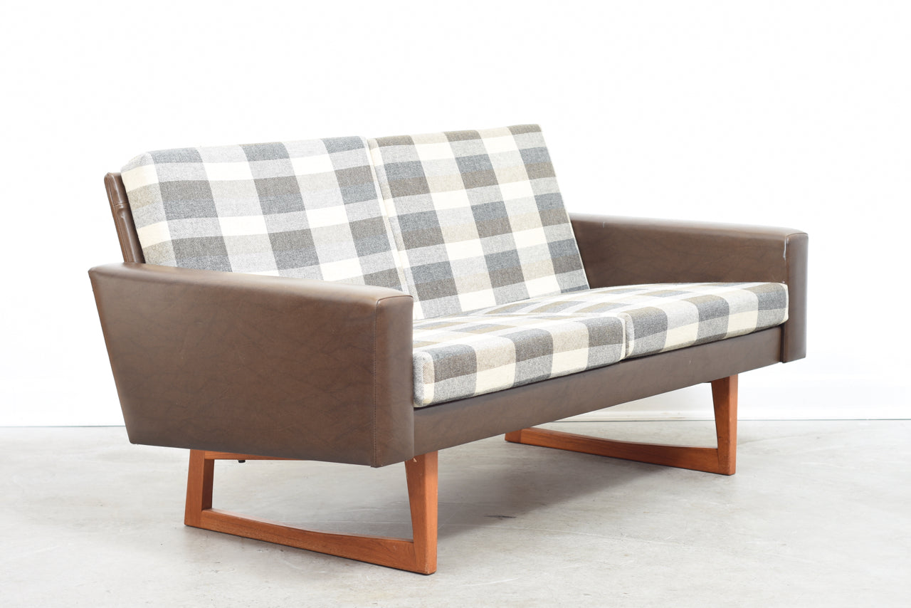 Two seat sofa on teak sleigh legs