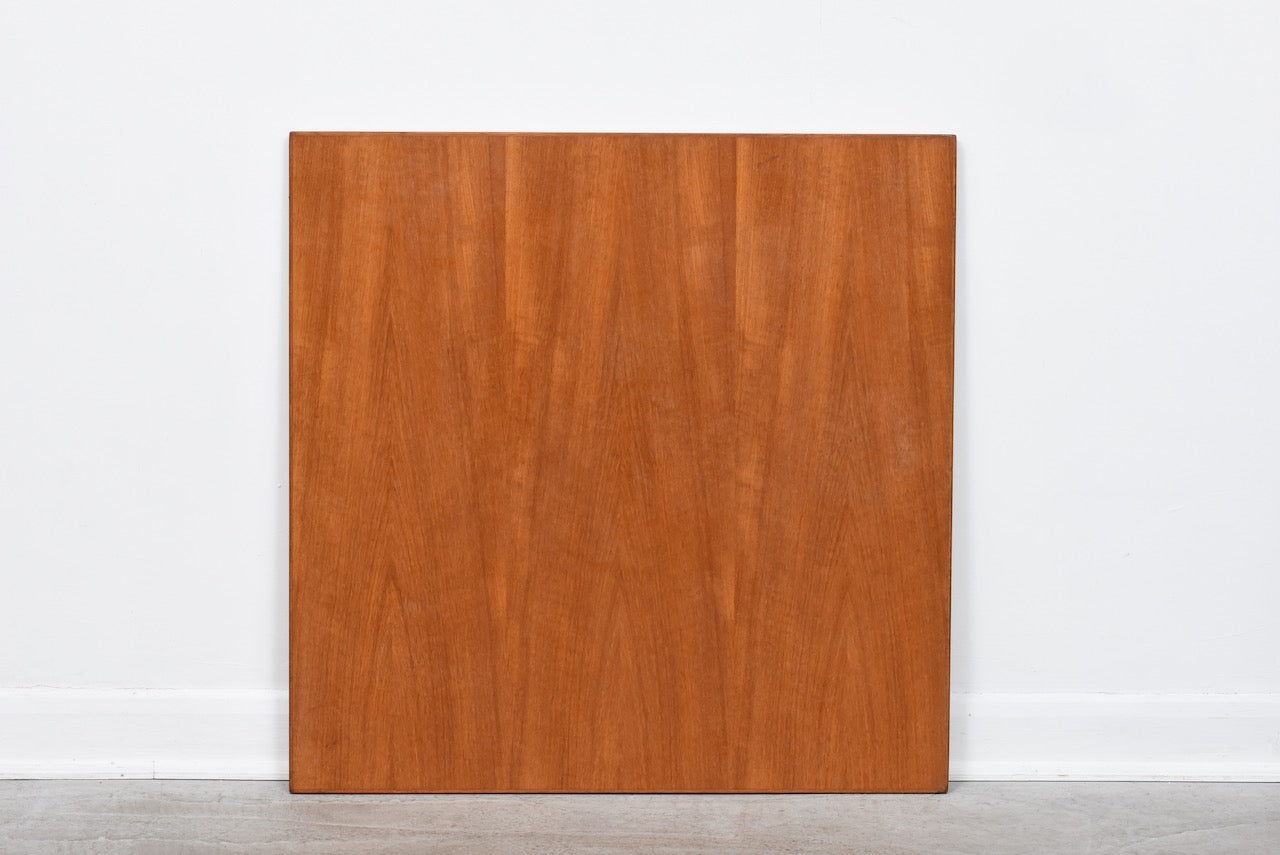 Extending square dining table in teak