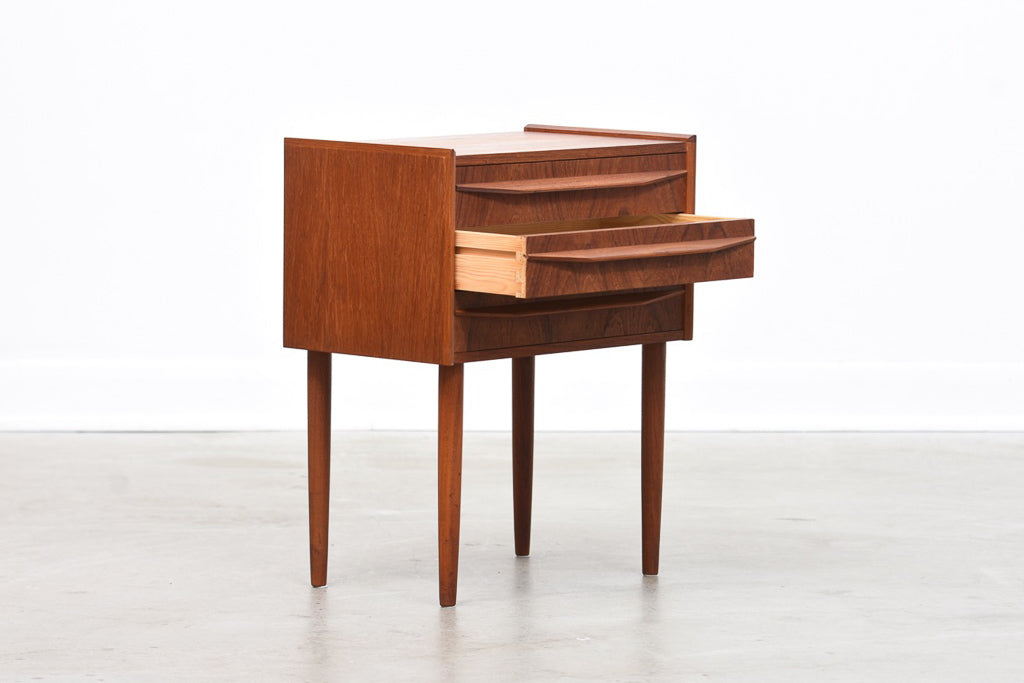 Low teak chest of three drawers