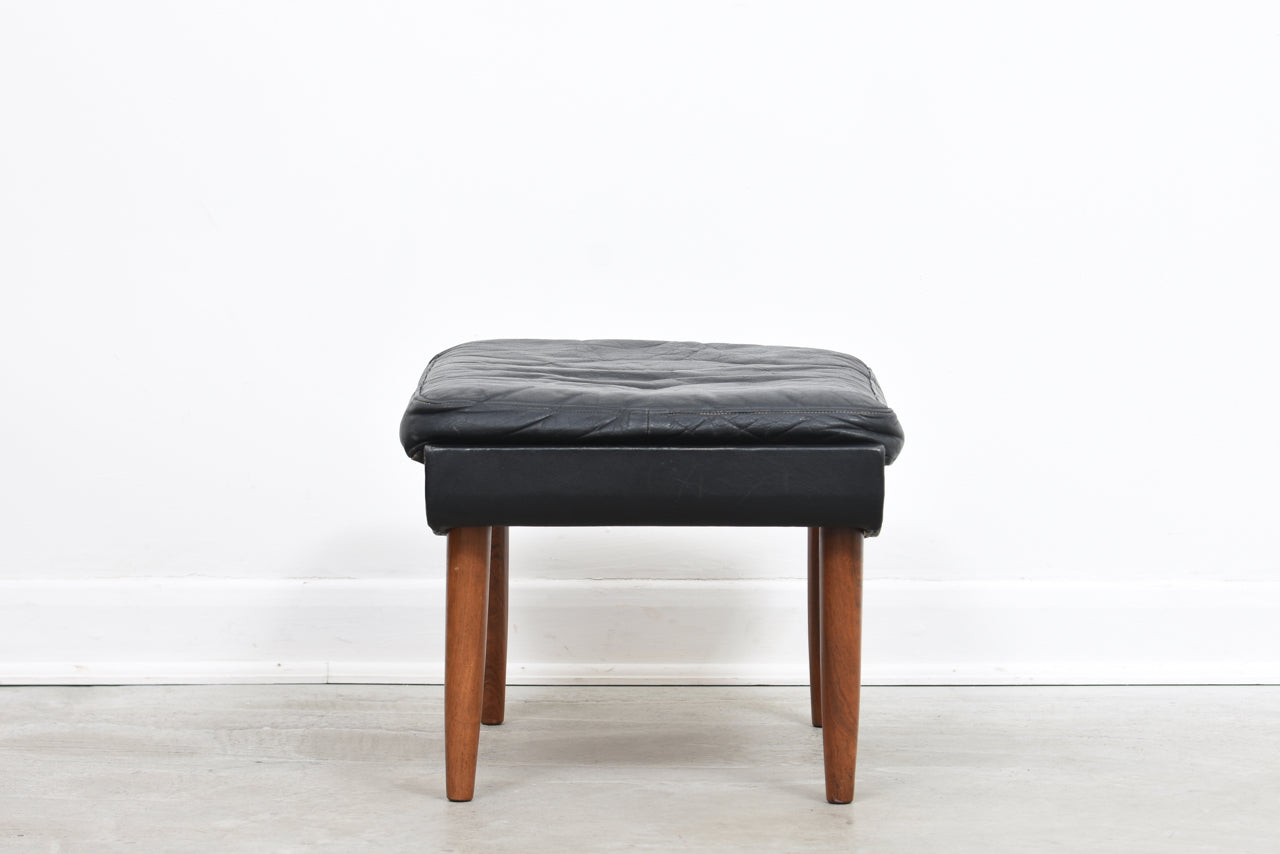 Leather foot stool on rosewood legs
