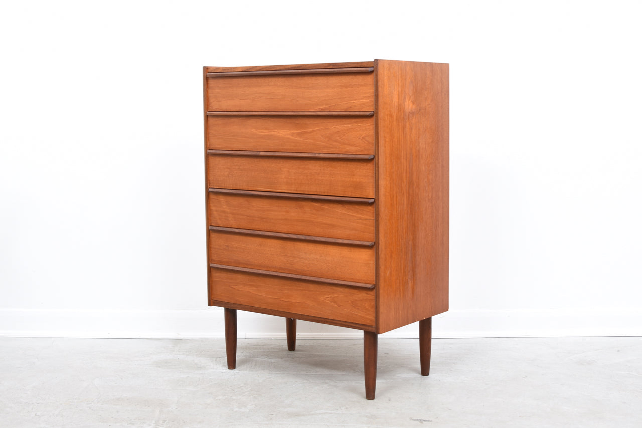 Teak chest of drawers with lipped handles