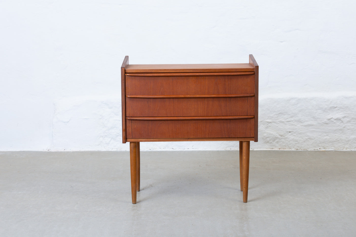 1960s low chest of three drawers in teak