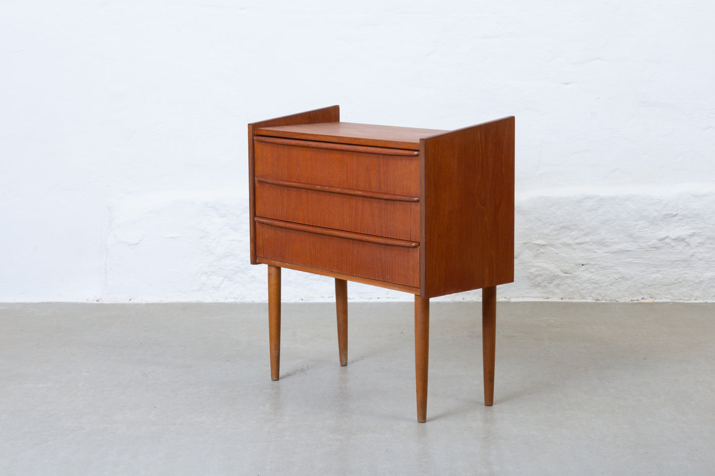 1960s low chest of three drawers in teak