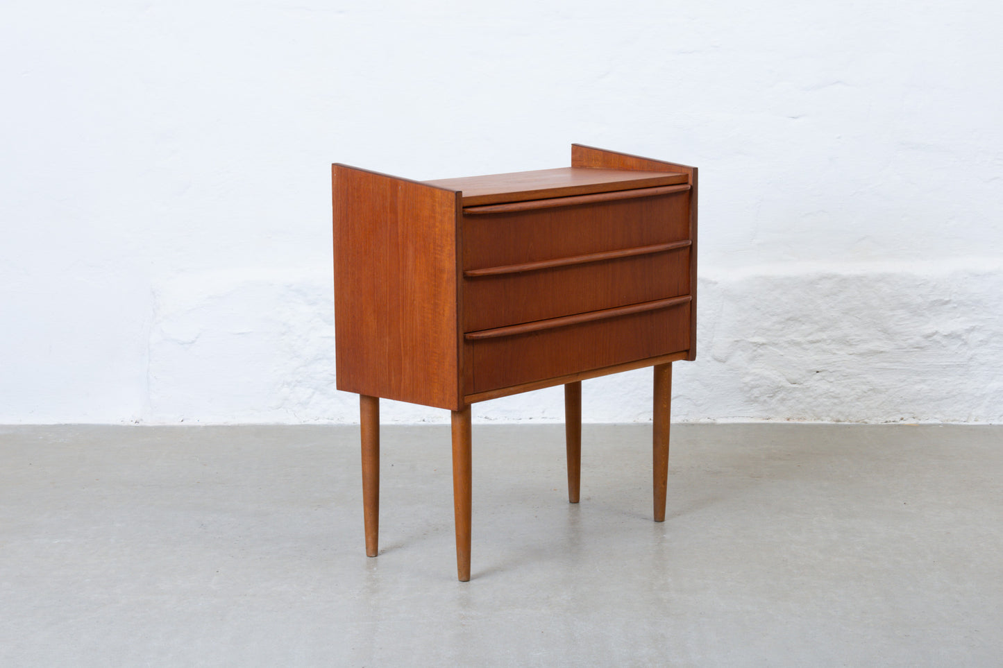 1960s low chest of three drawers in teak