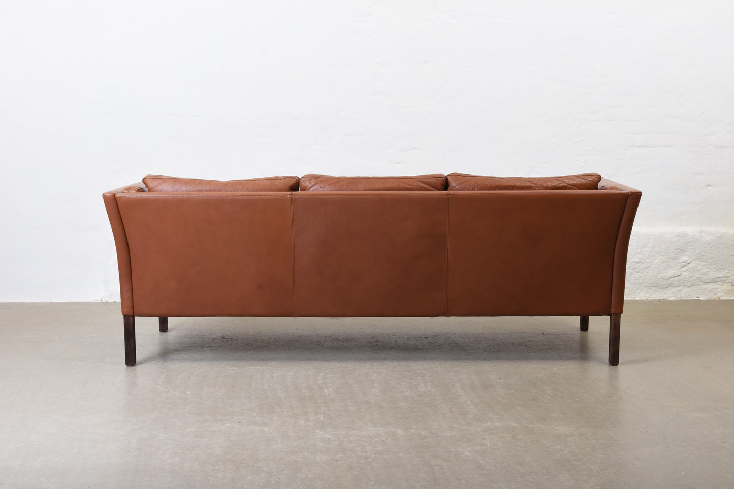 Vintage Danish three seater in cognac leather