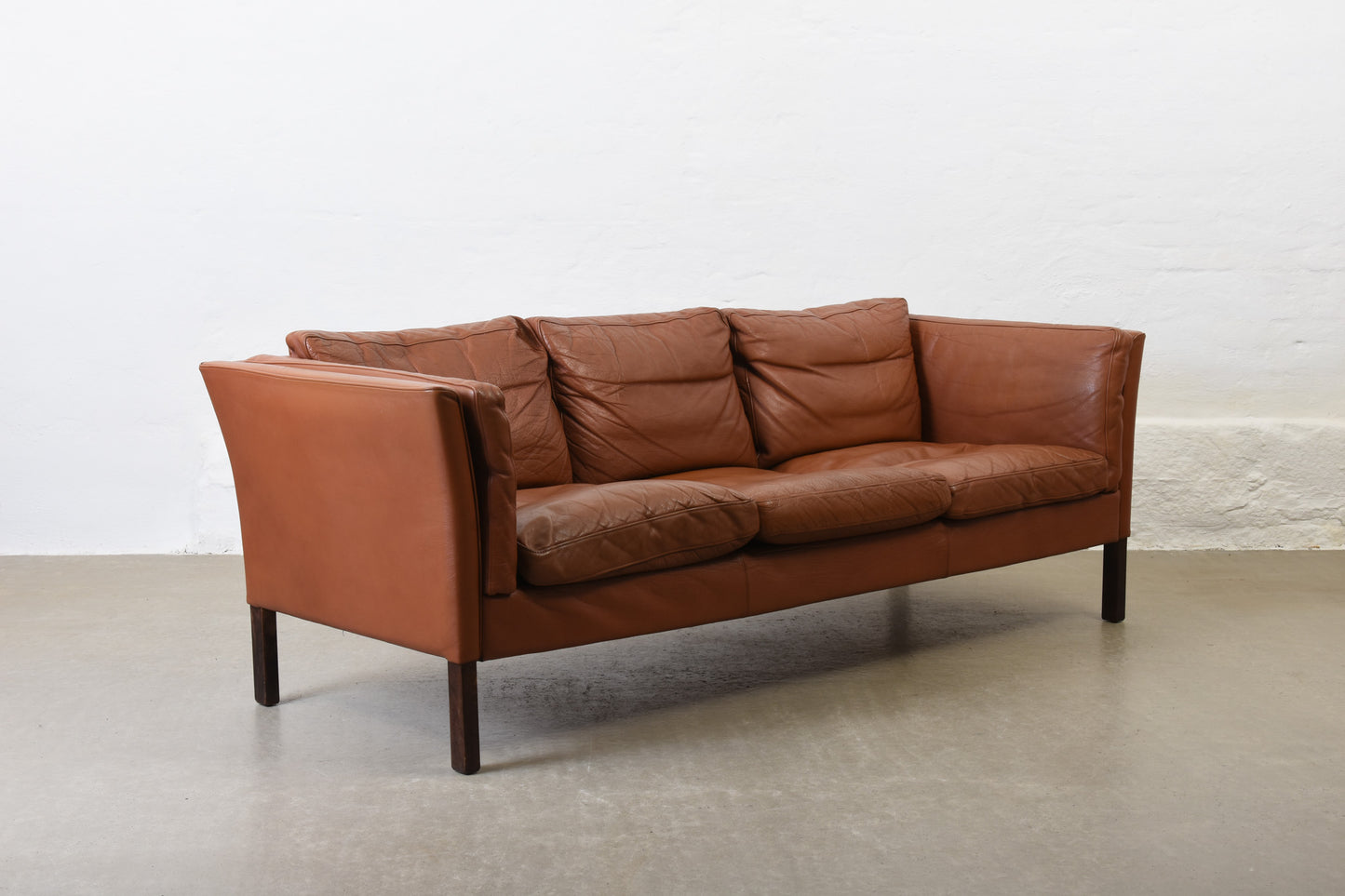 Vintage Danish three seater in cognac leather