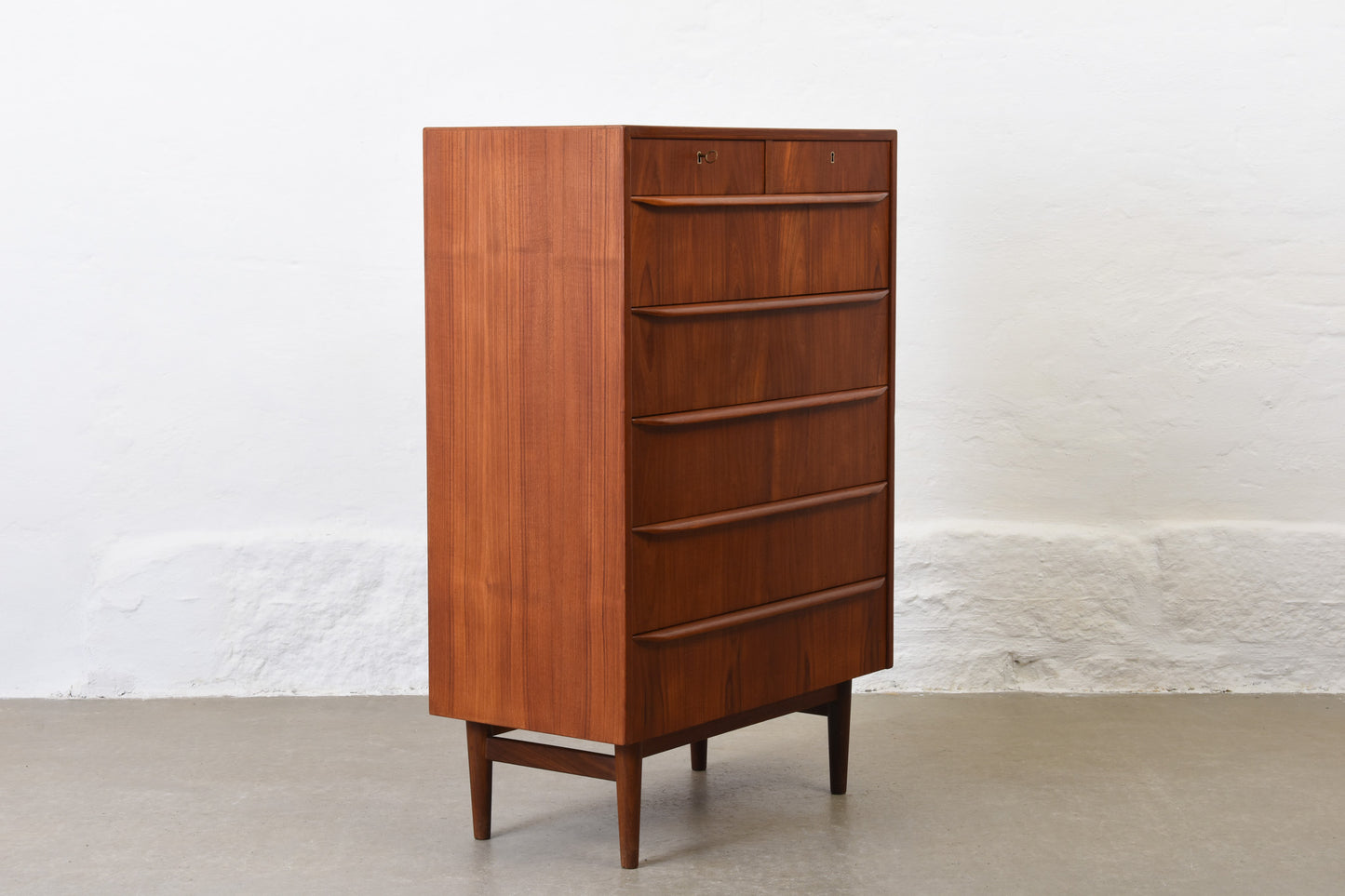 1960s teak chest of seven drawers with lipped handles