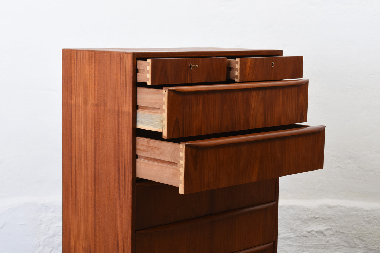 1960s teak chest of seven drawers with lipped handles