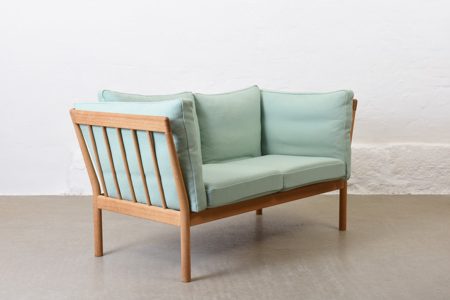 Newly reupholstered: 1980s oak two seater by Finn Østergaard